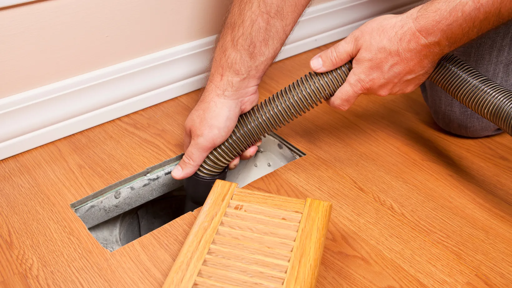 Tony Kelly HVAC Inc. | Why You Need Your Air Ducts Cleaned After a Storm in Tallahassee, FL Air duct cleaning service being performed in a home